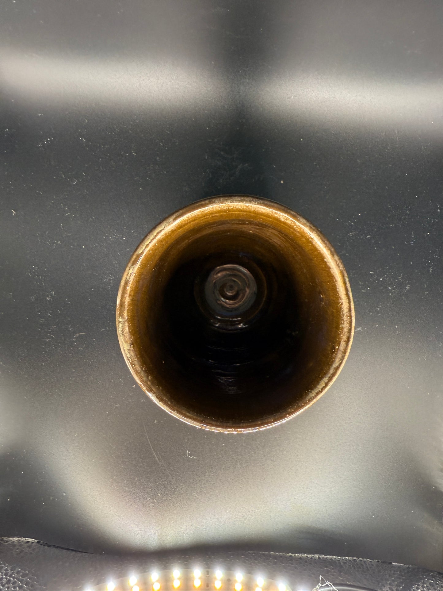 Handmade Brown Ceramic Cup with Wave-Inspired Ripple Design – Unique & Artistic