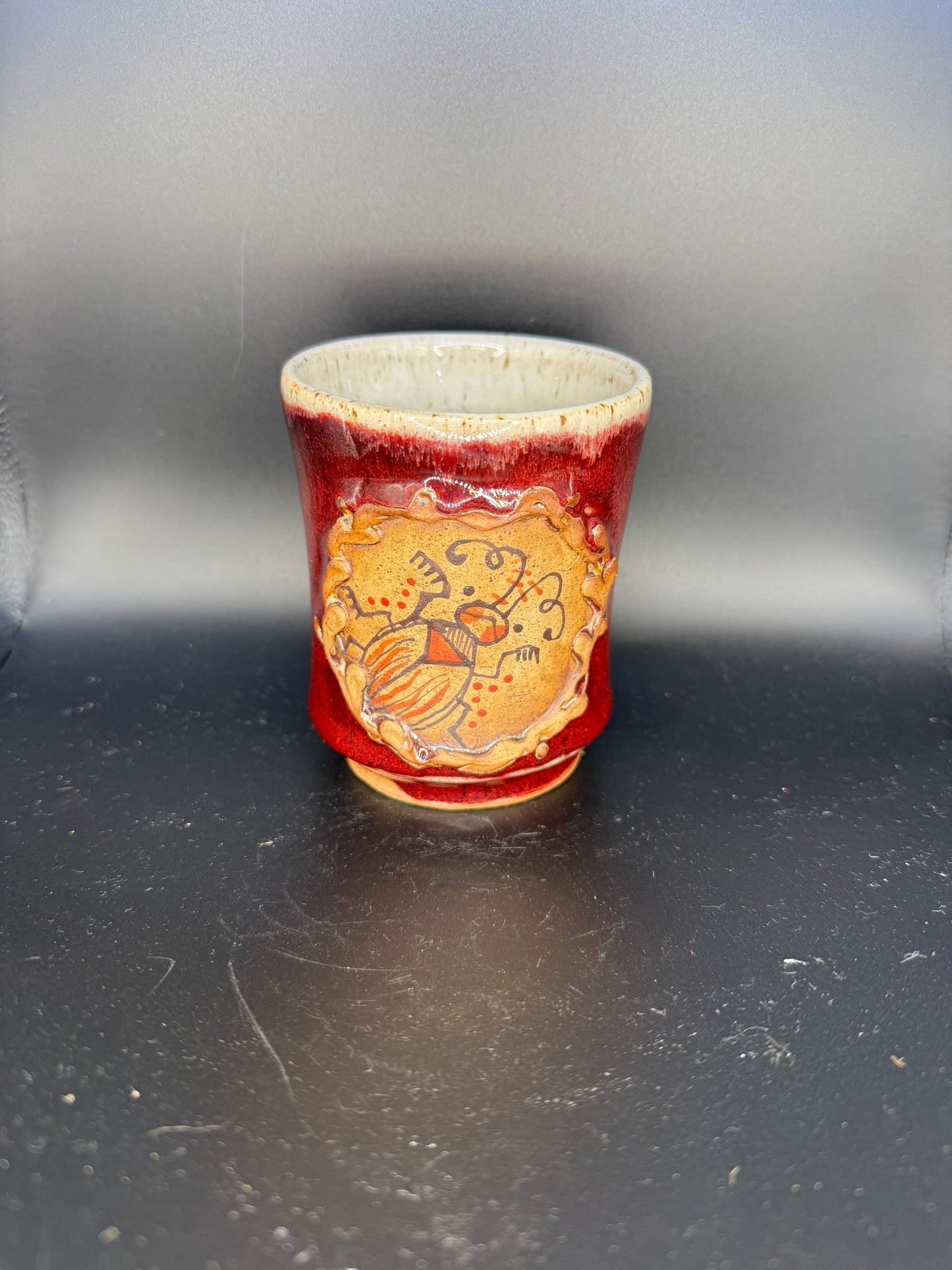 Handmade Ceramic Cup – Red Exterior with Hand-Drawn Bug Design & White Interior with Black Dots