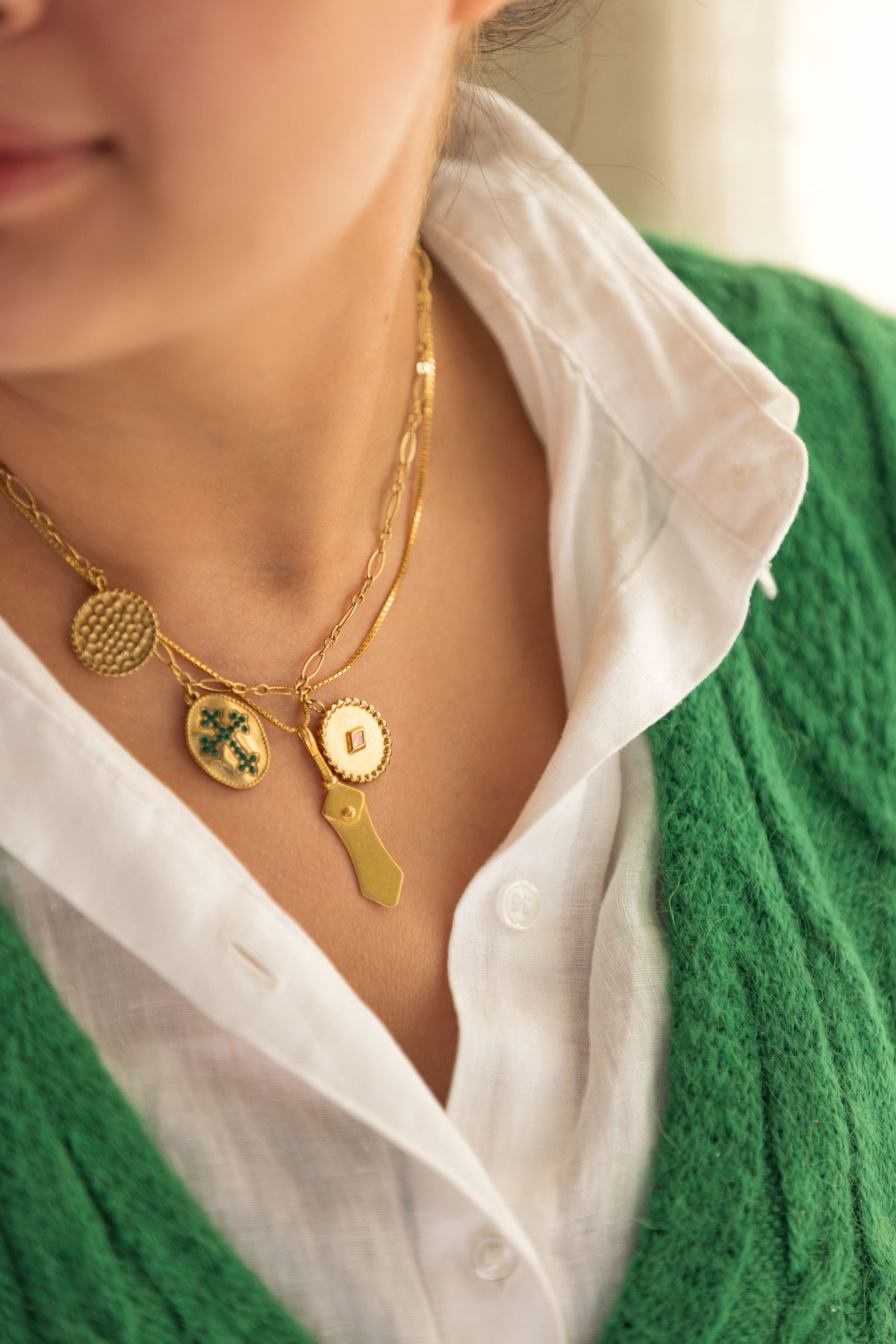 Gold charm necklace with multiple charms made at The College Artisans Shop charm bar